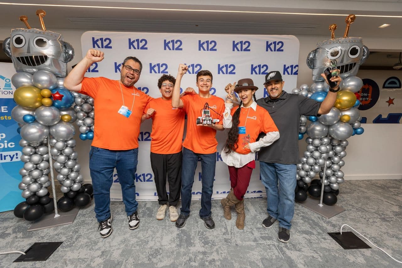Celebrating at the K12 photo wall after the awards ceremony.